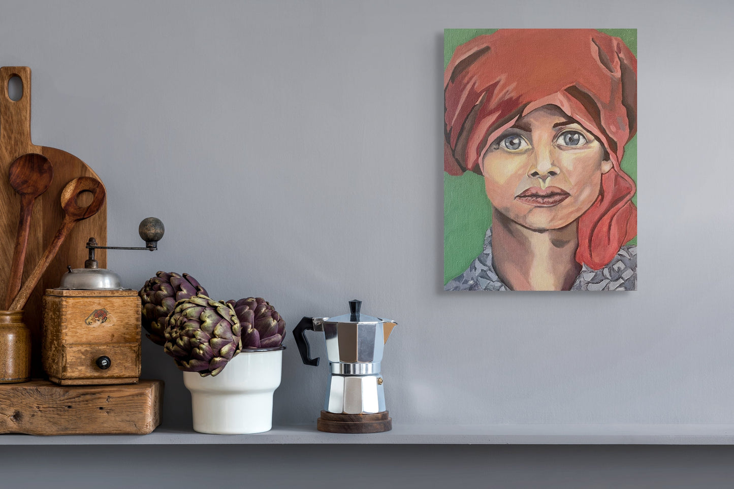 Painting of a girl in a red turban above a shelf with an Italian Coffee Pot.