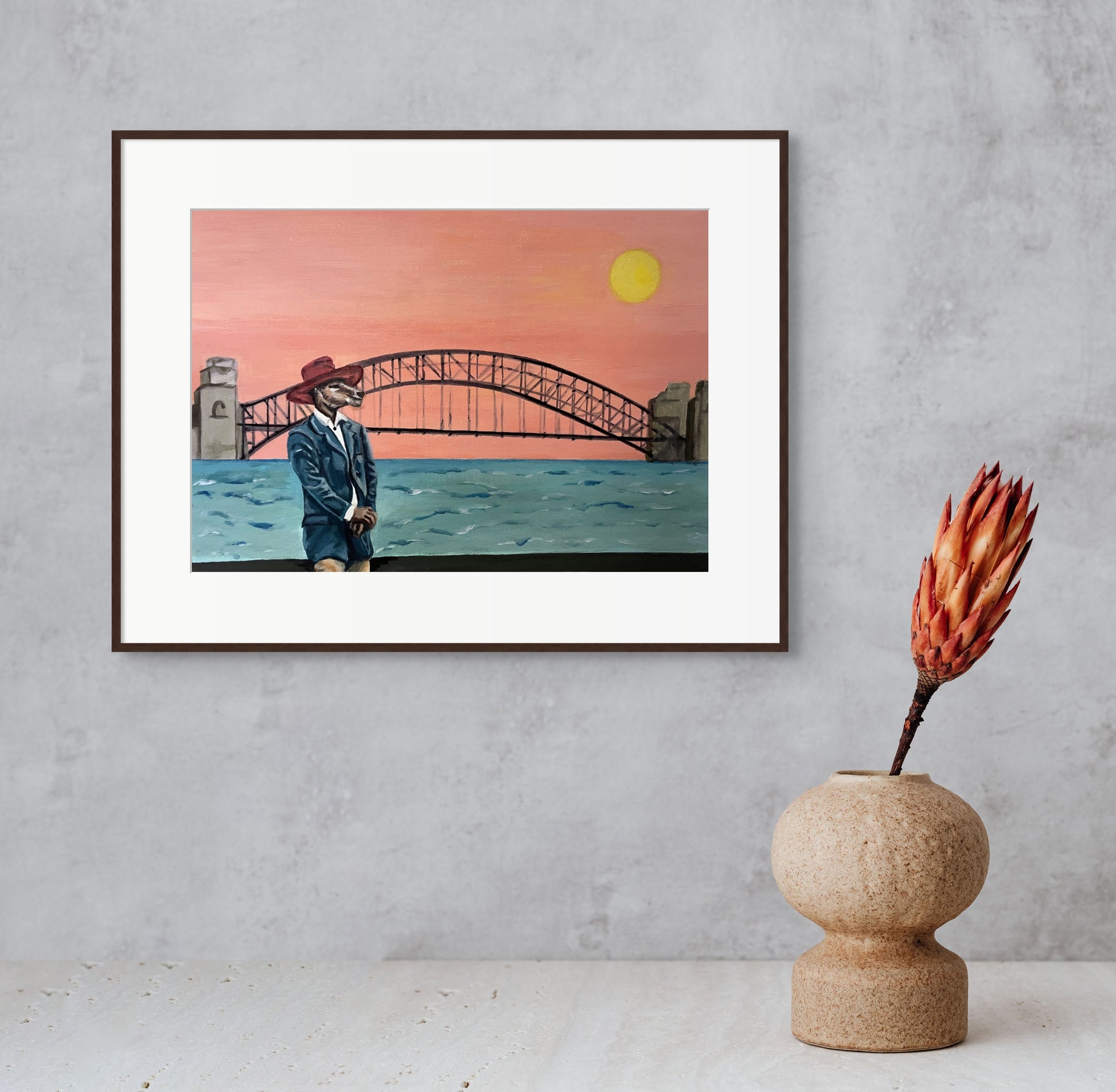 Framed painting of a kangaroo in a suit standing in front of the Sydney Harbour Bridge