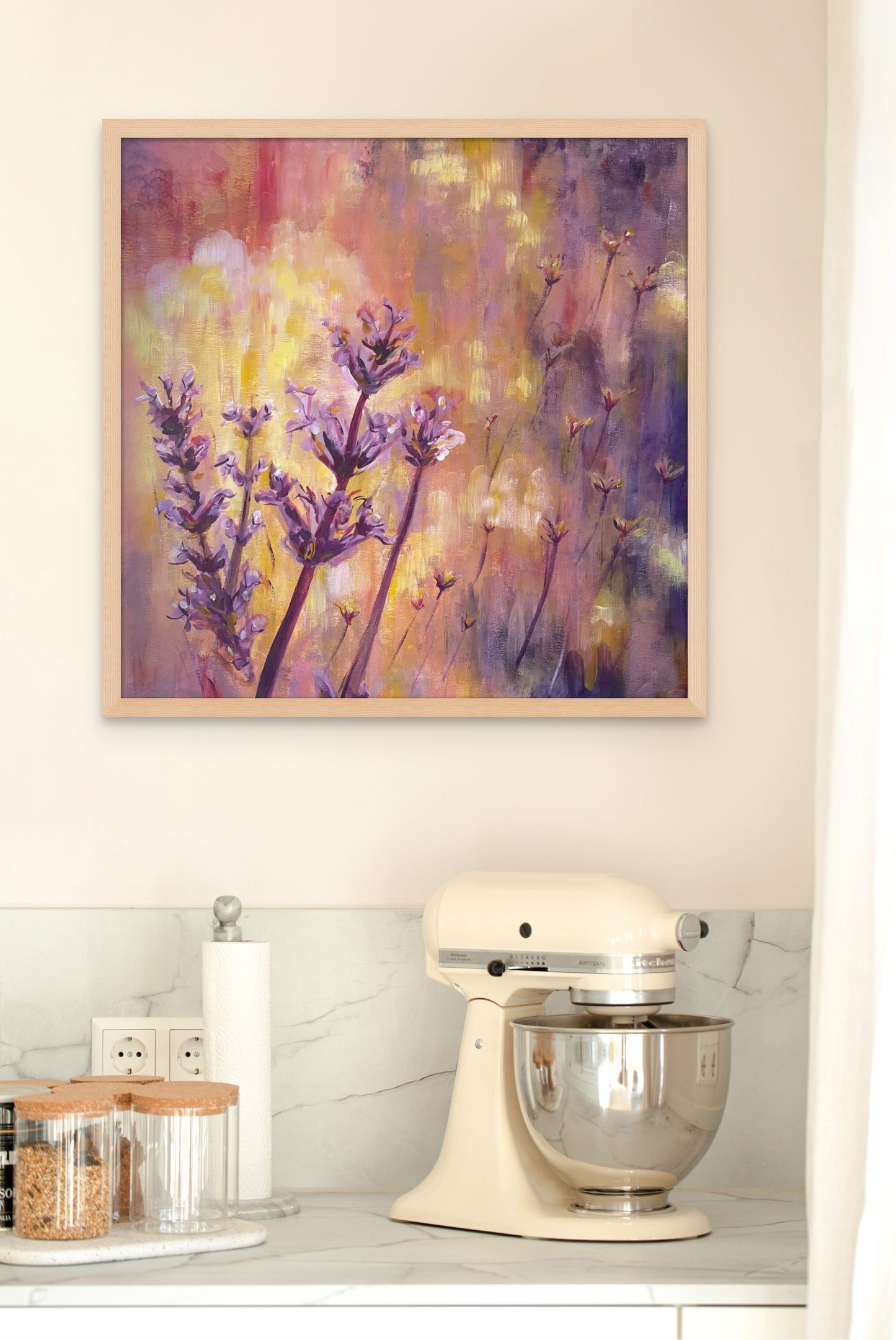 Painting of lavender with a glowing twilight background, hanging above a white granite kitchen bench.