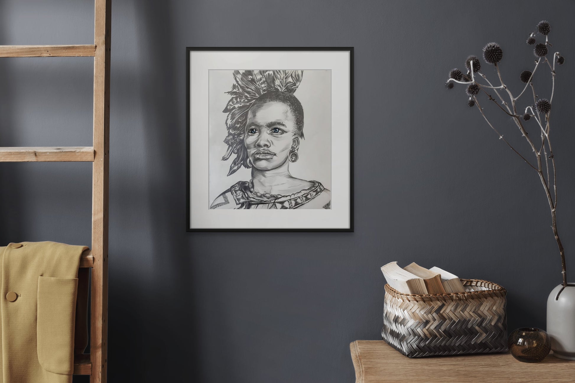 Portrait in pencil of an African tribal Chief wearing a feathered headdress hanging in a bedroom setting.